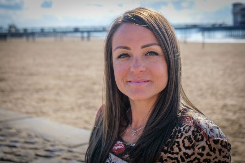 Jeni Crane Nutritional Therapist, Nutritionist and phlebotomist headshot at Weston Super Mare beach. Nutrition